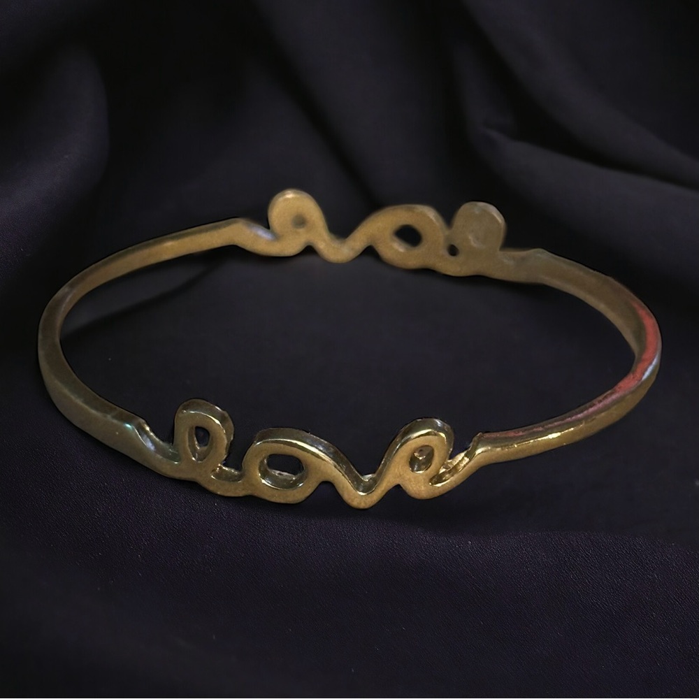 Gold tone cursive love bangle bracelet
